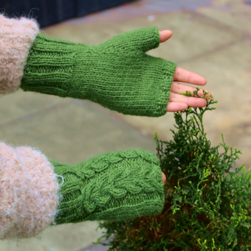 Women alpaca wool fingerless gloves adorned in front with beads.