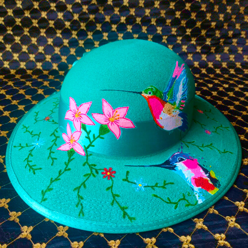 Hat color emerald green from Huancayo with a special draw design.